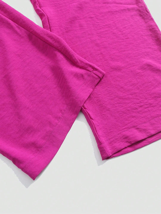 Udhulet plisseret jumpsuit med brede ben