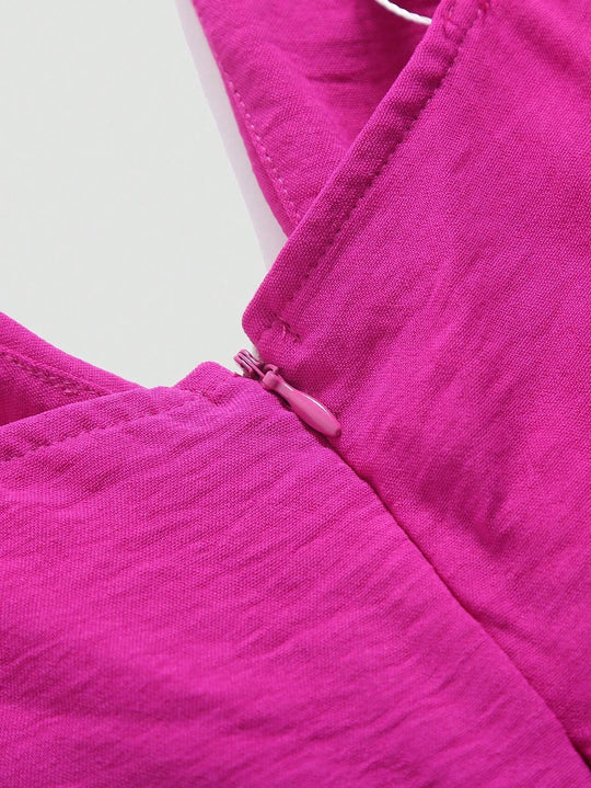 Udhulet plisseret jumpsuit med brede ben