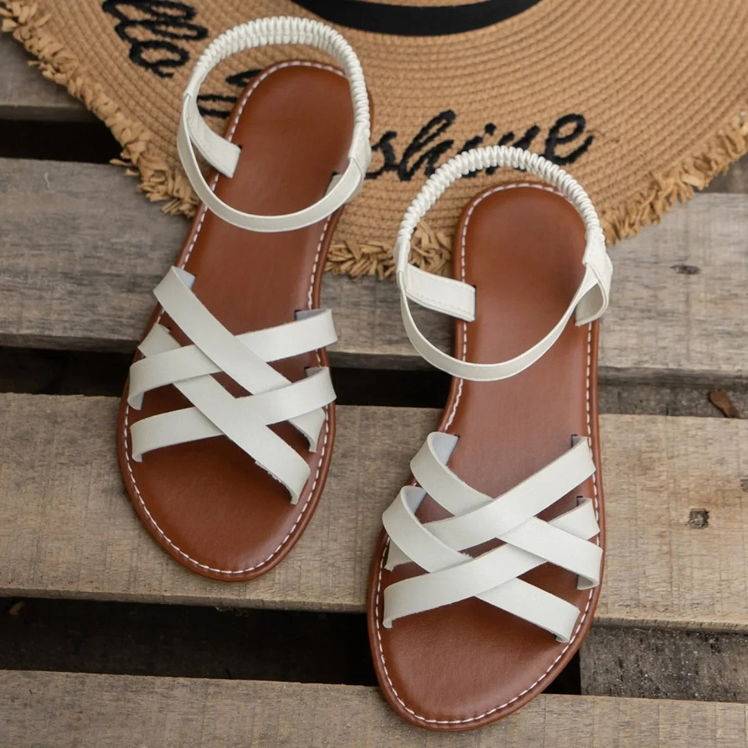 Flade sandaler med elastisk rem til kvinder
