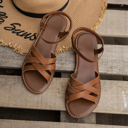Flade sandaler med elastisk rem til kvinder